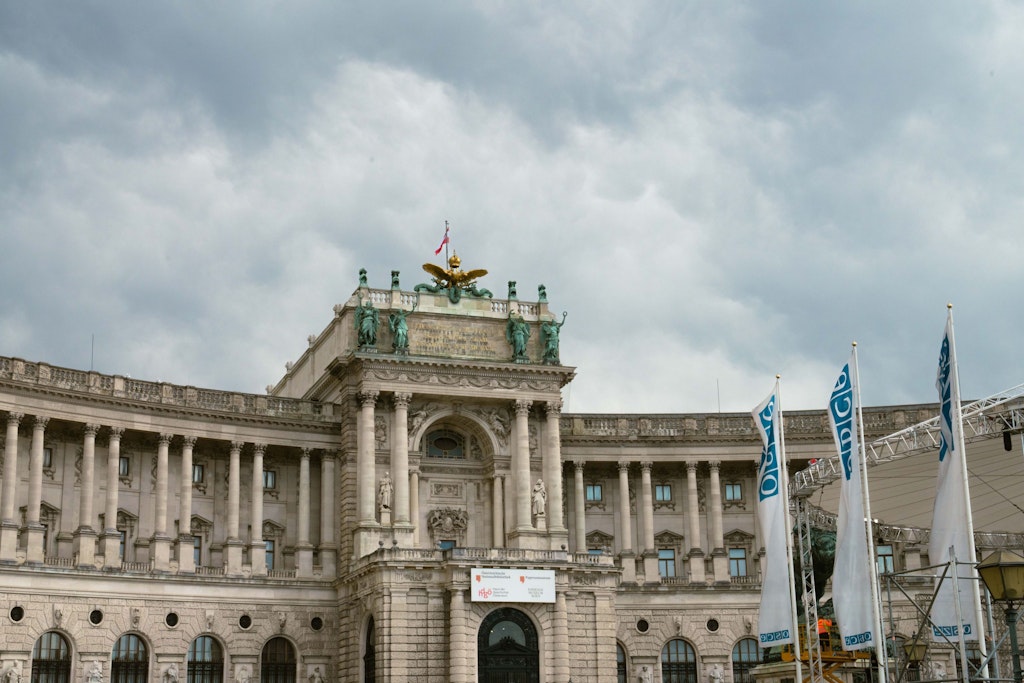 The image shows the main building of the OSCE in Vienna.